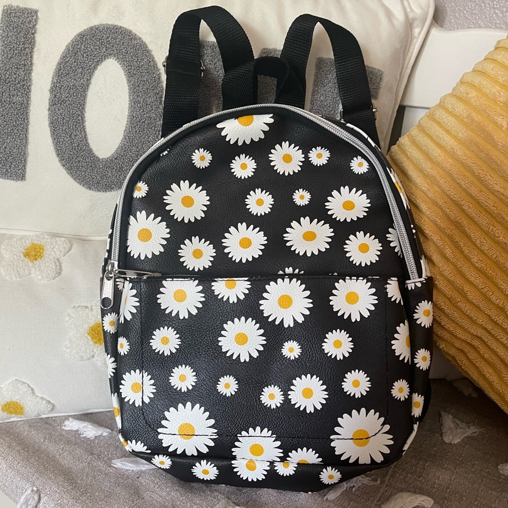 Super cute black with Daisy patterned small backpack!